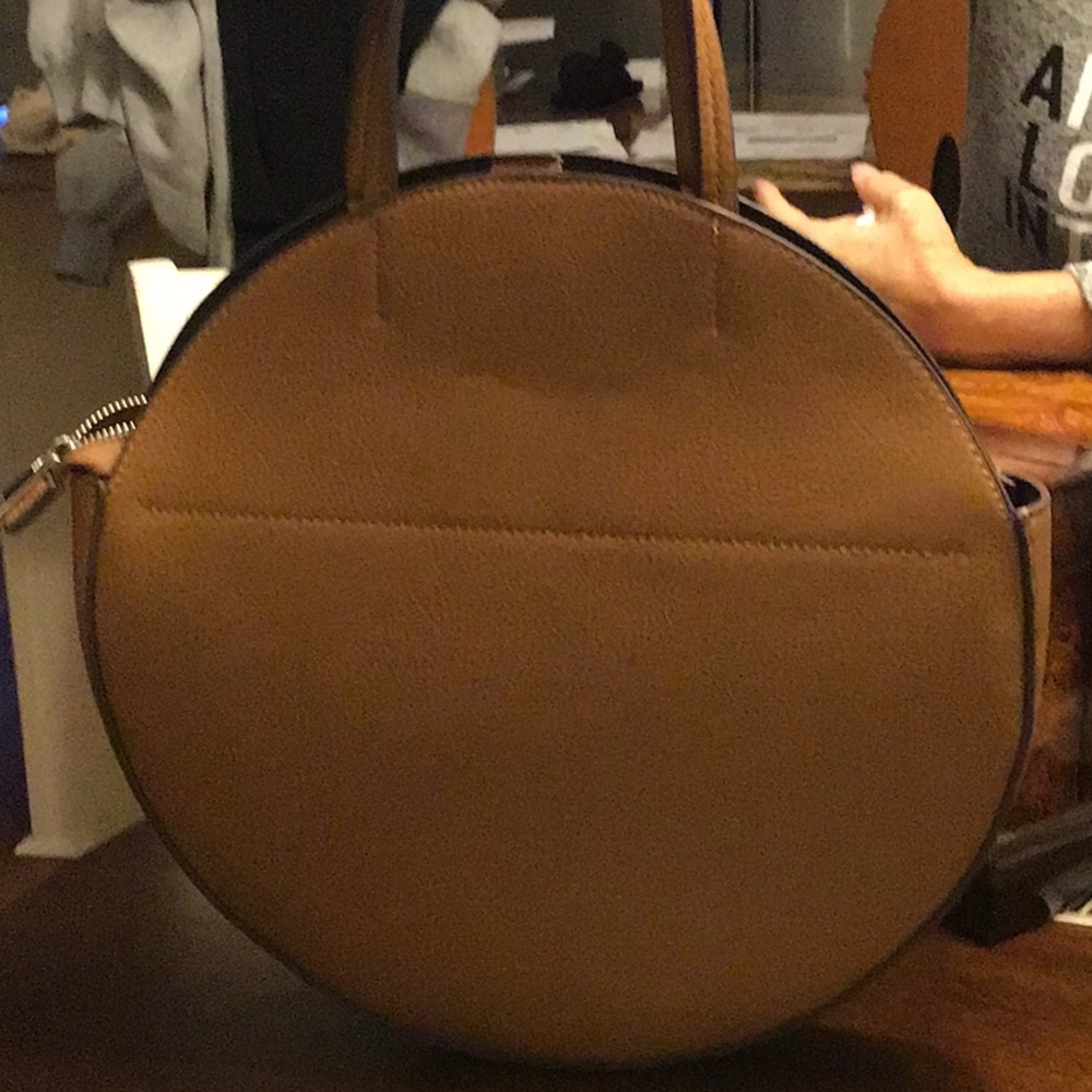 Carlos Santana Round Bag. 13” round. Caramel color